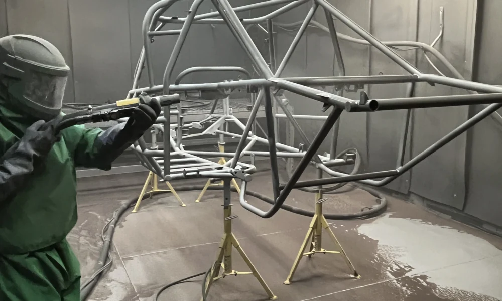 Sandblasting a roll cage chassis