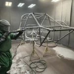 Sandblasting a roll cage chassis